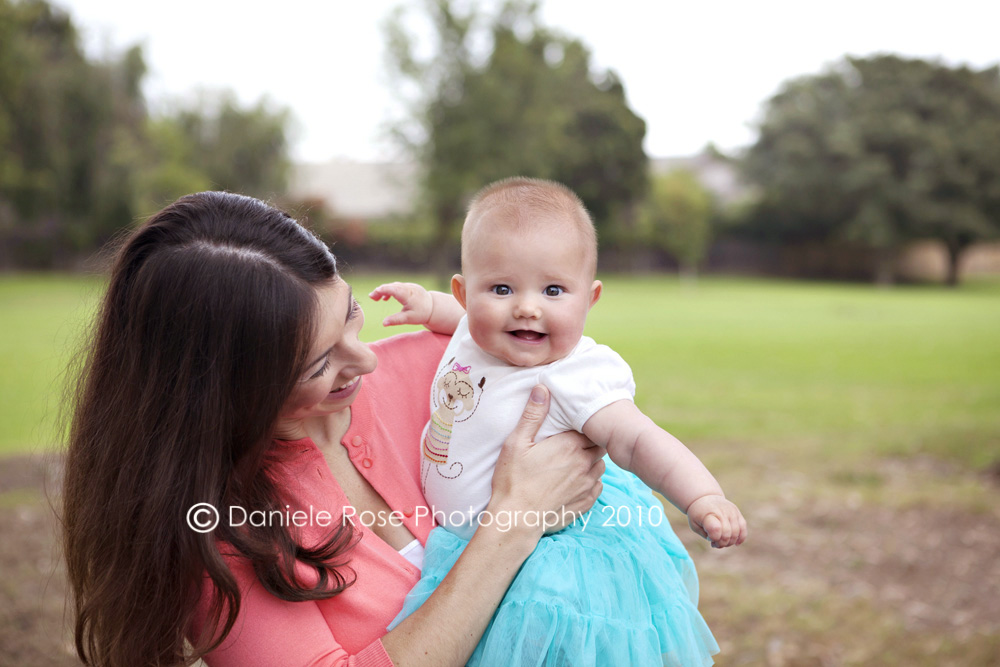Camarillo Baby Photographer • Ventura Infant Photographer A baby smiles and laughs during her photo shoot with photographer Daniele Rose